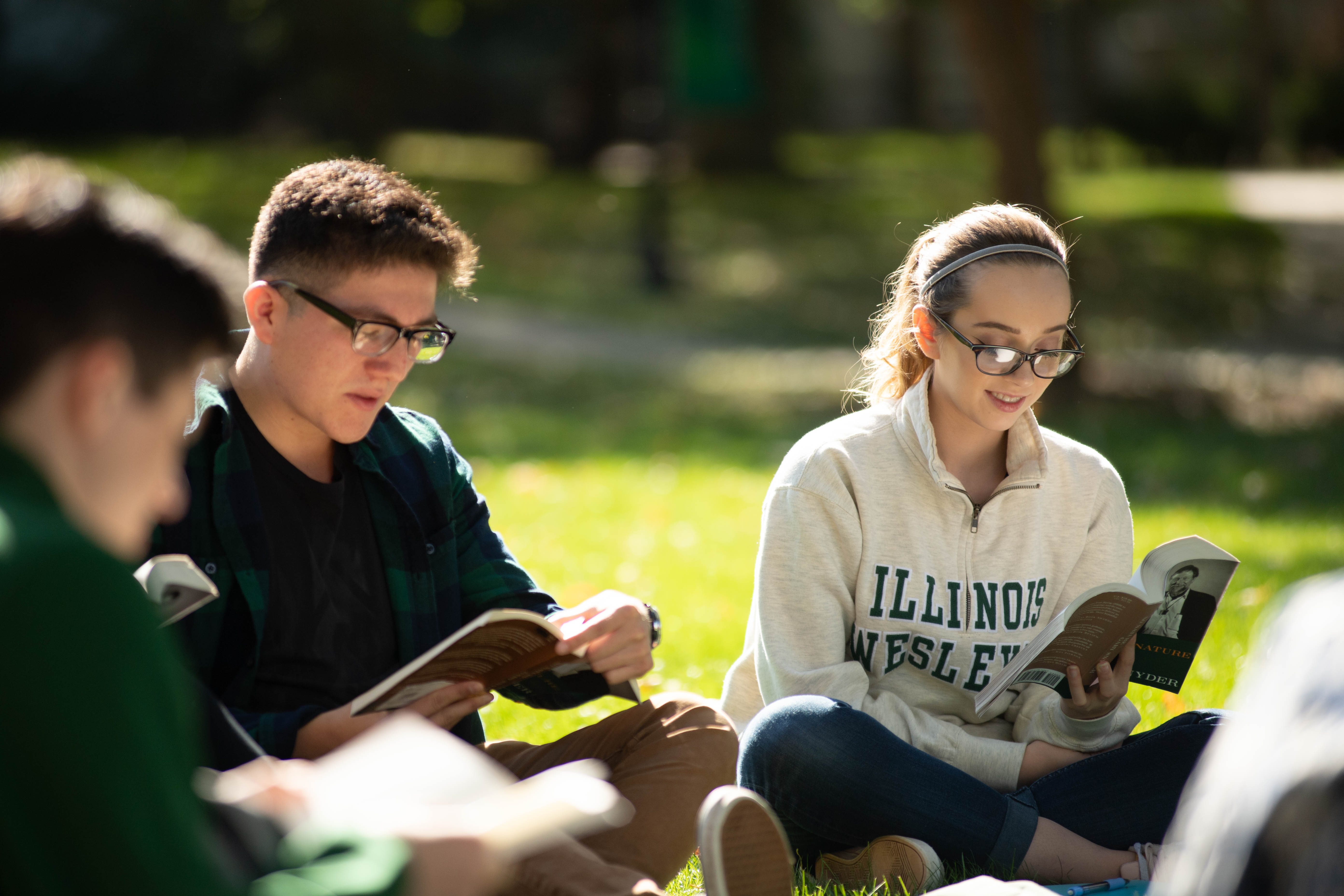 Students reading on the quad